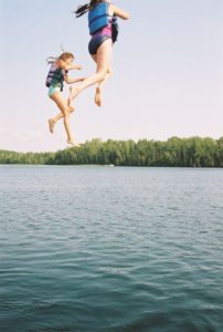 Wakeboarder airborne over Wabana Lake