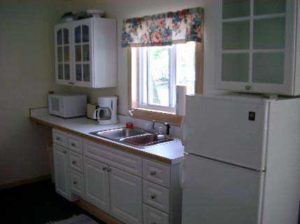Cabin 3 kitchen with white cabinets