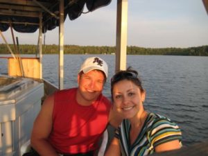 Couple seated on a boat at Wabana Lake