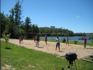 Guests playing sand volleyball at the resort