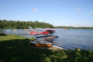 Red-and-white seaplane at the dock