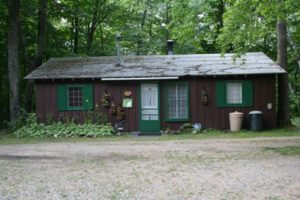 Rustic brown cabin among the trees