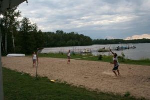 Guests playing on the sandy beach