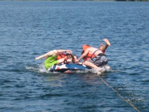 Guests relaxing on an inflatable tube
