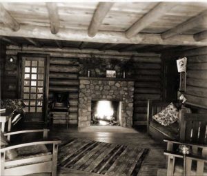 Inside the old log lodge with its stone fireplace