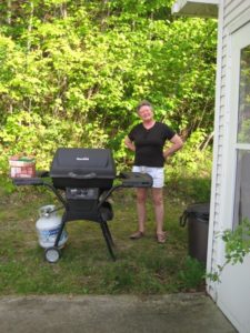 Guest grilling beside the screened porch