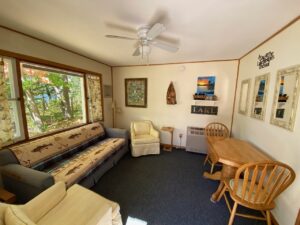 Cabin 3 living room with a sofa and lake décor