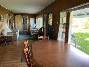 Cabin 7 dining and sitting area with a lake view
