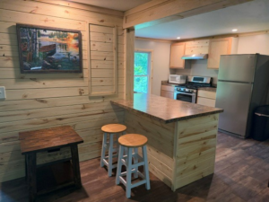 Cabin 1 kitchen with an island and stainless steel appliances