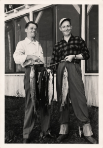 Two men displaying a large stringer of fish at the resort